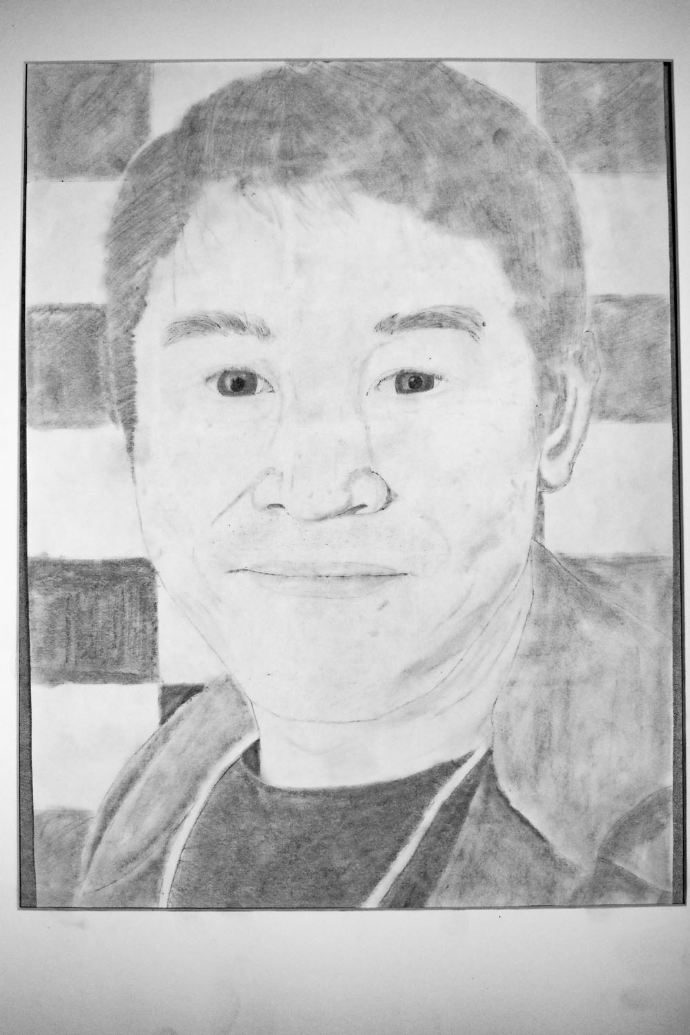 Pencil drawing of man with a checkered background Pencil drawing of man with a checkered background