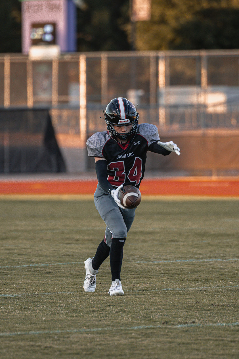 DRHS Football player kicking the ball