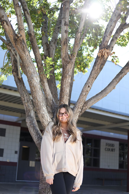Kaysha by a tree in the courtyard Kaysha by a tree in the courtyard