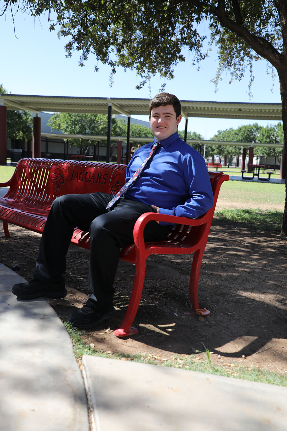 Matthew on a bench in courtyard Matthew on a bench in courtyard