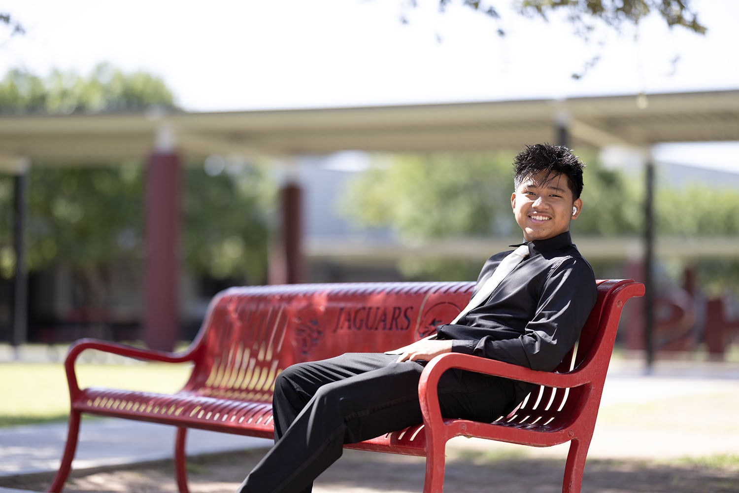Victor smiling on a bench Victor smiling on a bench