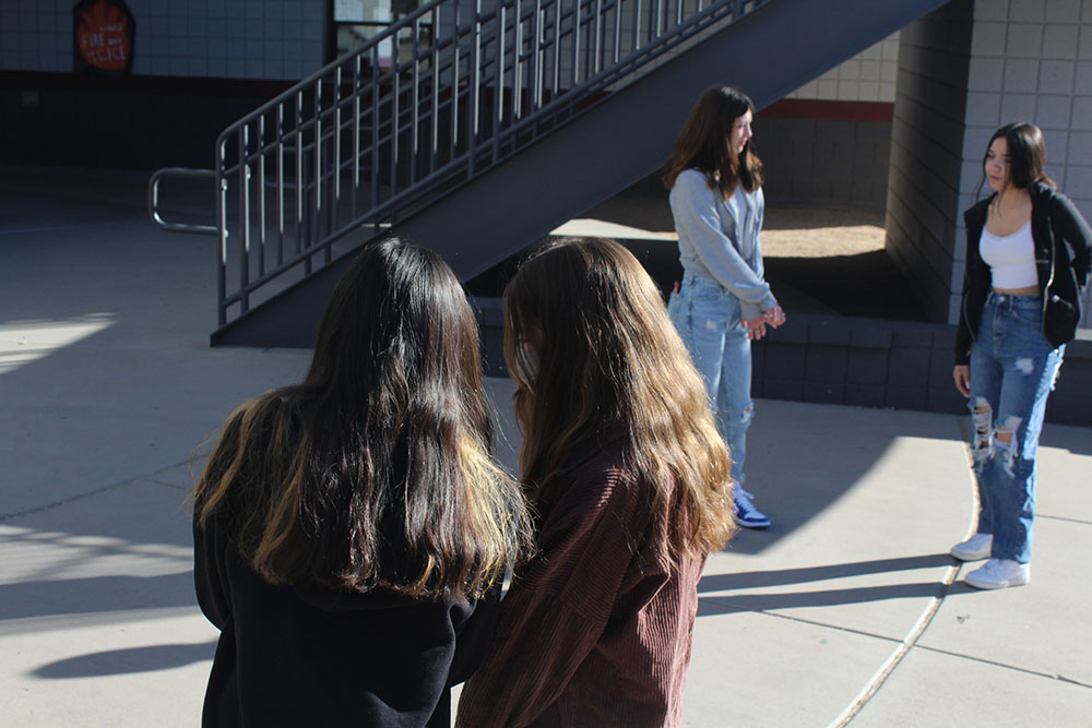 Ethina and Samanth looking at photograghy camera